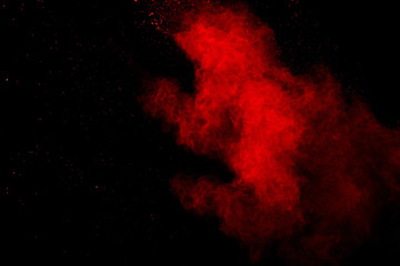 Abstract Red powder splatted background,Freeze motion of red powder exploding/throwing green dust.