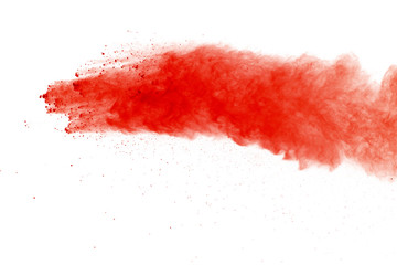 Red powder explosion on white background. Paint Holi.