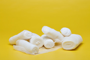 Plaster bandage roll and scissors