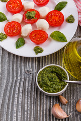 Caprese salad on a wooden rustic background