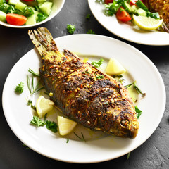 Grilled fish on plate