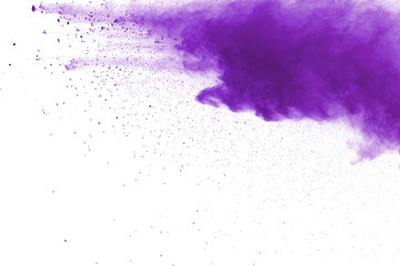 Purple powder explosion on white background. Colored cloud. Colorful dust explode. Paint Holi.