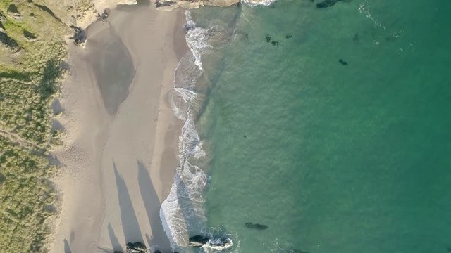 Aerial views of waves breaking on the pristine beaches of Sango Sands and surrounding area at Durness in Scotland.