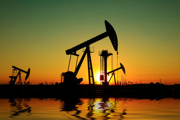 Beam balanced pumping unit under the setting sun