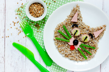 Healthy breakfast for kids - buckwheat porridge shaped cute cat, animal face food idea