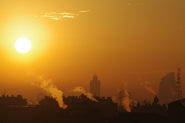 Fototapeta premium sunset in the city,Milano,italy,sun, city, orange, landscape, skyline,silhouette,urban, yellow, light,building, 