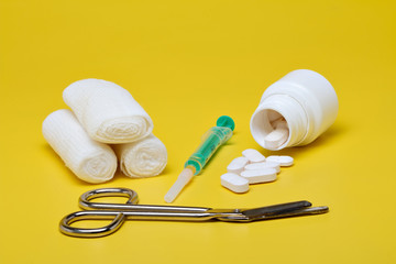 Plaster bandage roll and scissors