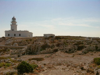 Fototapeta na wymiar South Light House along the coast in white color and blue sky background