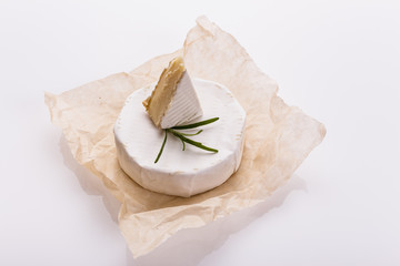 delicious creamy camembert cheese on a white background