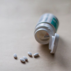 closeup of pill bottle and pills