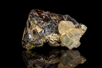 Macro of a mineral stone Sphalerite with fluorite and pyrite on a black background close up