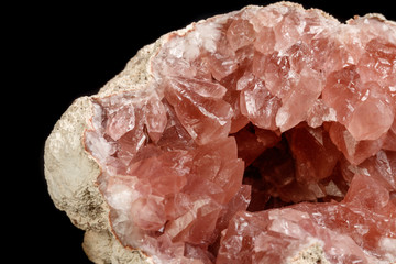 Macro mineral stone Pink Amethyst on a black background