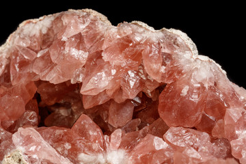 Macro mineral stone Pink Amethyst on a black background