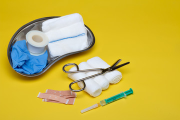 Plaster bandage roll and scissors
