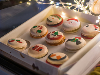 Fototapeta premium Box with french dessert - multicolored tasty macaroons. French cuisine, Christmas, candy, holiday, new year and food concept