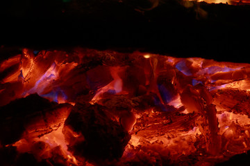 smoldering coal with blue fire
