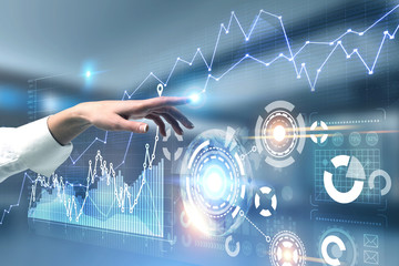 Woman hand using graph and infographics interface