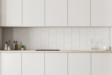 Fototapeta na wymiar White countertops in tiled kitchen