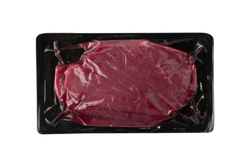 Vacuum black plastic pack with fresh beef steak isolated