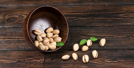 Obraz na płótnie Canvas Wooden bowl with mixed nuts