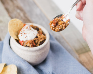 Holding a Spoonful of Mexican Dinner