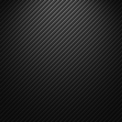 Vector carbon fiber texture. Dark background with lighting.