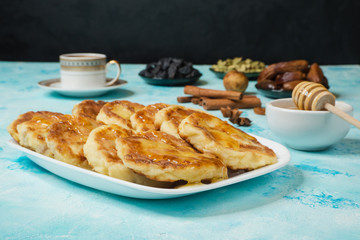 Msabeeb is a flatbread. Arabic dessert with honey, cardamom, cinnamon and raisins.