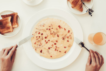 Hands With Knife And Fork. Breakfast Concept.