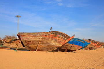 Wooden fishing boats in the drying