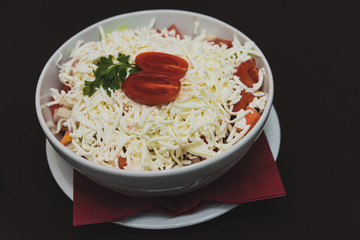 Mixed  tomatoe salad with grated white domestic cheese