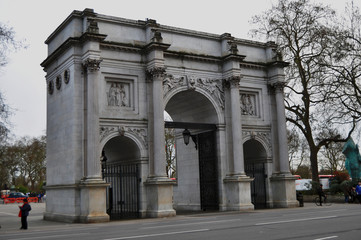 Fototapeta na wymiar London, UK - APR 06, 2018: The Marble Arch monument and gates with Oxford Street beyond West End