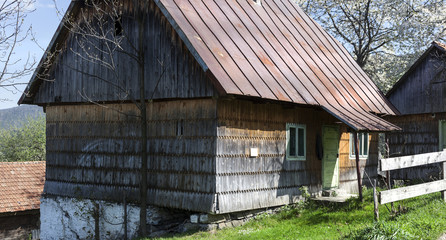 Typical rural scen in Patrahaiesti Fall with provincial house in Romania