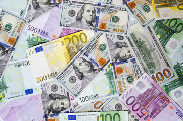 Obraz na płótnie Canvas euro banknotes and dollars randomly laid out 4