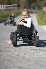 girl play with toy car