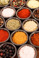 Herbs and spices on a wooden background
