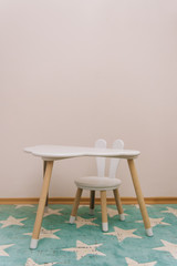 Cute children's room in bright colors. cloud table and chair with Bunny ears