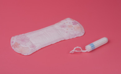 cotton medical towel or pad for women critical days on pink background. Care and protection.