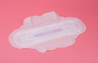 cotton medical towel or pad for women critical days on pink background. Care and protection.