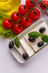 A piece of feta cheese on a white background