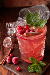 Raspberry drink with ice and cinnamon