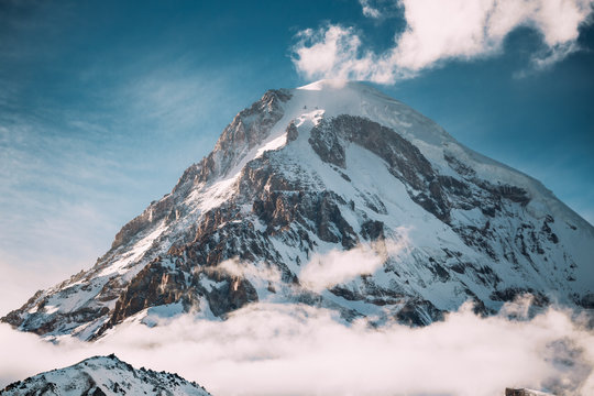 Georgia. Peak Of Mount Kazbek Covered With Snow. Kazbek Is A Str