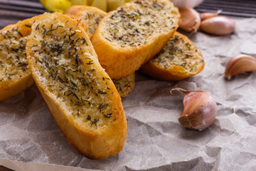 fragrant garlic bread on a rustic wooden background