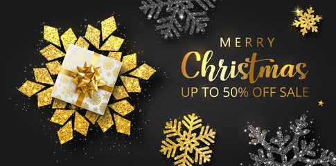 Merry Christmas sale promo poster with top view gift and shiny snowflakes.