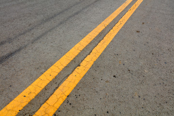 Fototapeta premium Yellow double solid line