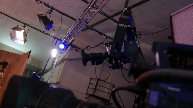 Behind the scenes view of professional video studio equipment