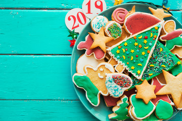 Plate with tasty holiday Gingerbread Cookies - Happy New Year card 