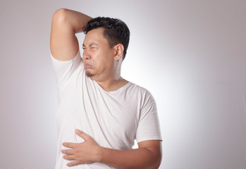 Man Check his Armpit Smell