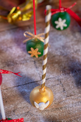 Various Christmas sweets and candies with christmas tree on wood table