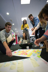 Startup business people in modern office. Group of young business people are working together with...