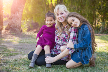 Fototapeta premium Caucasian Grandmother With Young Mixed Race Grandaughters Outdoors